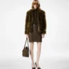 Blouson en peau lainée avec détails en cuir Blouson en peau lainée avec détails en cuir