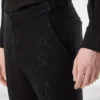 Pantalon bouclé léger à paillettes Pantalon bouclé léger à paillettes