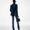 Pantalon évasé en denim brut stretch Pantalon évasé en denim brut stretch