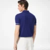 Polo en cachemire et soie à passepoil contrasté